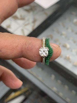 Wax was made to fit engagement ring , and then it's casted in gold and set with diamonds to match the ring,