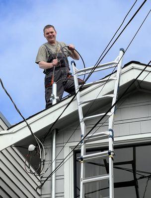 Overhead electrical service upgrade in progress, completed by licensed electrician Sam