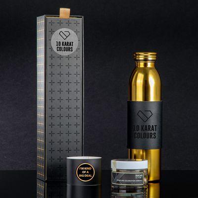 Golden drinkware, champagne candy, and a lapel pin with "I'm kind of a big deal"