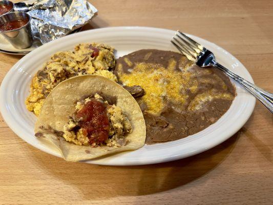Machaca and Eggs - Shredded beef, tomato, onions, bell peppers with salsa and corn or flour tortillas.