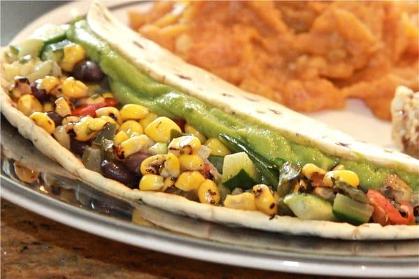 ROASTED VEGETABLE WRAP - Mediterranean flat bread filled with roasted vegetables, served with sweet potato casserole and nut clu