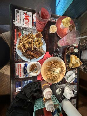 Two ribs, pulled pork, brisket, fries. Brisket tacos, onion appetizer, fried okra