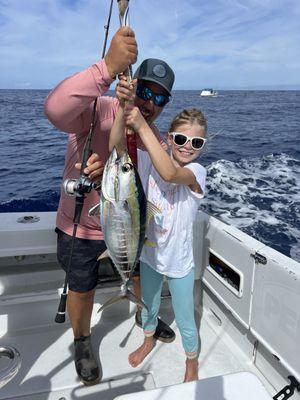 Capt Shawn delivering a HOT Tuna bite for our daughter