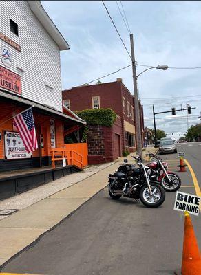 Motorcycle parking out front.