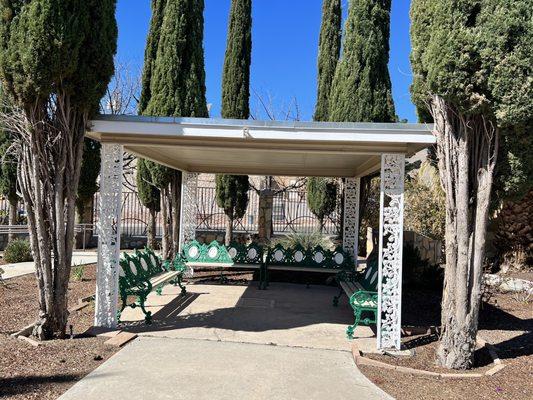 A calm and inviting pergola/patio to sit and relax at