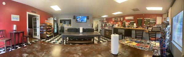 Main room, places to sit, eat, and watch Tv. Room to the left is another room great for relaxing or having a small meeting.