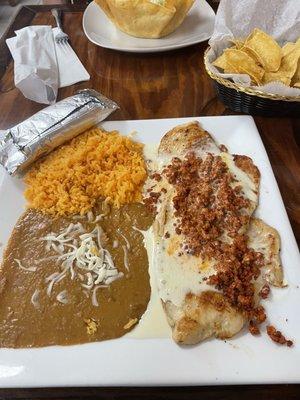 Chicken topped with chorizo queso