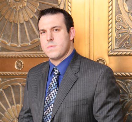 Mr. Neufeld by a downtown Phoenix courthouse