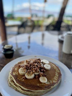 Banana pancakes with coconut syrup & toasted macadamia nuts.