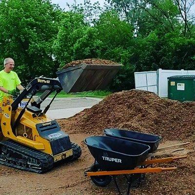 Mulch Installation. We utilize efficient equipment to get your landscape project completed on time and within budget.