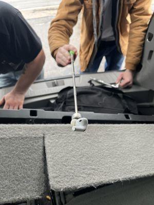 AirPod found within a crevice worthy of a championship Operation game.