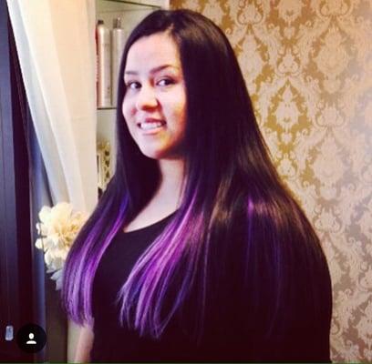 Purple skin weft (tape in) hair extensions.