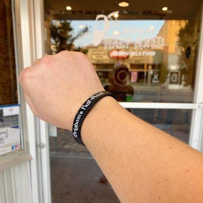 Fromt of the door and the wristband I got for signing the waiver!