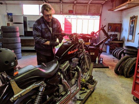 Bill fixing a bunch of stuff on my Harley