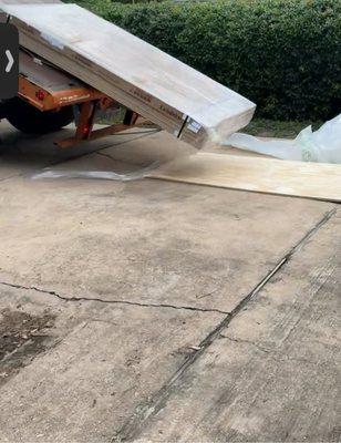 Melamine sheets (fragile) being dumped on the road