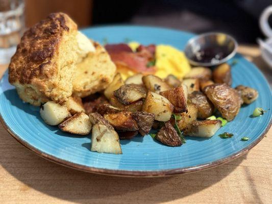 Standard breakfast with scrambled eggs and homemade biscuit