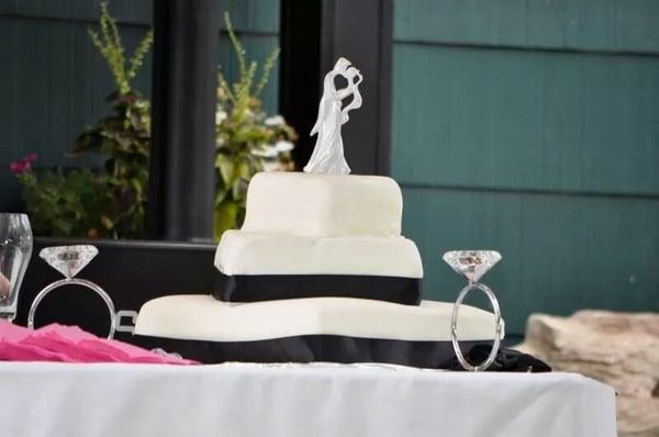 It was lopsided. cake showed through some parts & on others the fondant was over super thick.