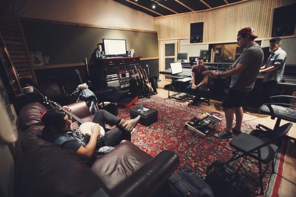 Working out my banjo parts in the control room while we track electric guitar. Photo by Francisco Gonzalez