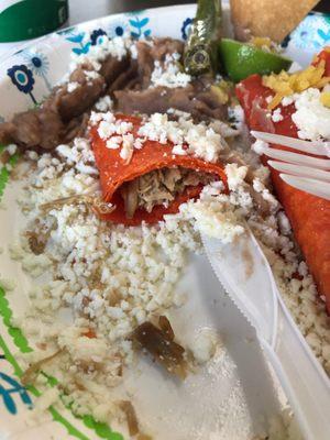 Beef enchiladas. Dried crumbled cheese and no enchilada sauce.