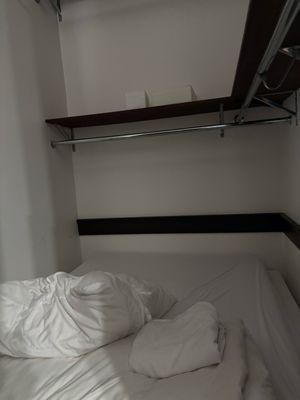 This is one of the "bedrooms", actually a bed literally stuffed into a closet.