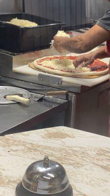 Pizza being made