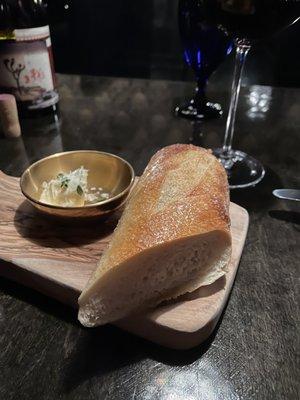 Great bread and butter for the table with fresh herbs. The lightly salted bread was delicious.
