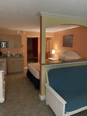 Queen room with food out couch bed.