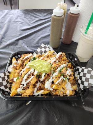 Loaded birriia and carnitas fries.