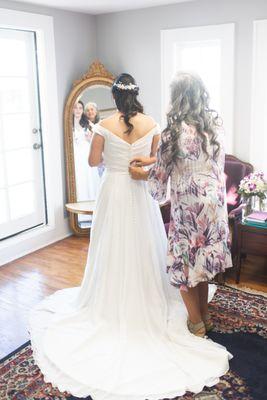 Mom helping me get ready in the bridal suite.