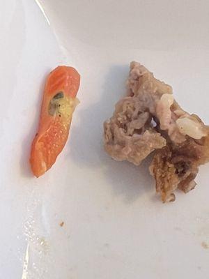 Piece of tomato with spoilage spot and gristly steak