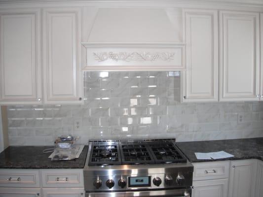 Wellington Ivory cabinets, Carrara Marble subway backsplash dark granite