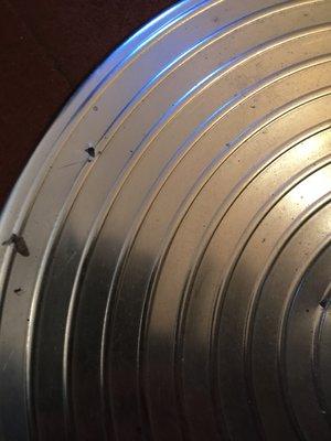 Holes punched in the bases of both my Tolomeo Mega lamps.