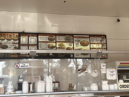 Prices and things selling: pie slices, slushees, combo meals