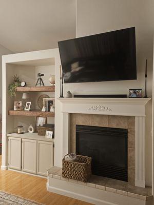 The shelves,painted cabnets and tv mount were all my work in this photo