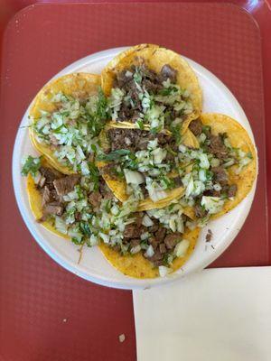 Plate with (2) asada tacos; (2) tacos al pastor; (2) cabeza