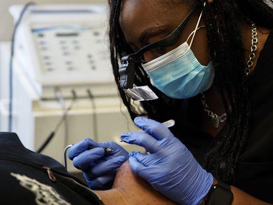 Performing chin hair removal services