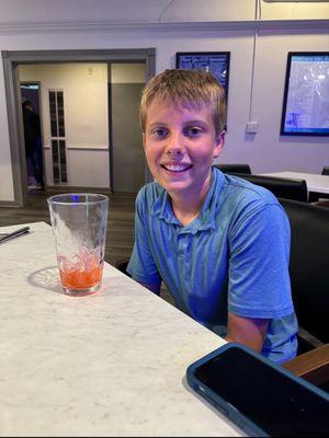 Celebrating with a Shirley Temple after his first 18 hole round!