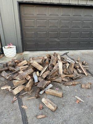 Firewood dumped in front of my garage