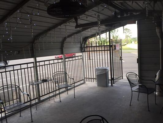 Smoking patio & additional parking in the back.