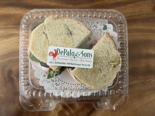 turkey sandwich: turkey, lettuce, tomatoes, and brie = $9.95