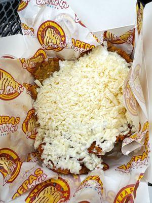 TOSTONES CON CREMA Y QUESO FRIED GREEN PLANTAINS WITH SOUR CREAM AND CHEESE