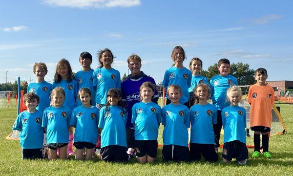 Coach Finn jamming out with the Dragons Soccer Academy