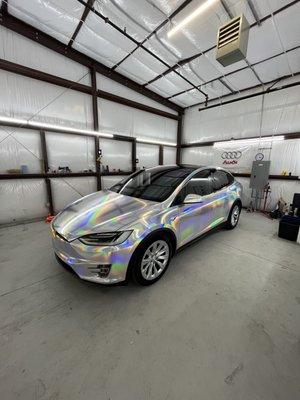 Tesla Model X wrapped in tinybotvinyl silver electroplated chrome. Covered with a ceramic coating protection package by Gtechniq HALO