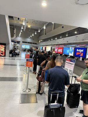 8/15/25. Deja vu. A long line with two people working.