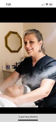 One of our technicians performing a facial