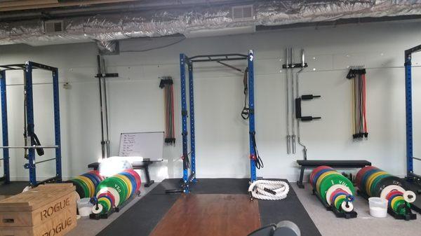 Each station has it's own set of barbells, bumper plates, resistance tubing, and other accessories like Battle Ropes and kettlebells.