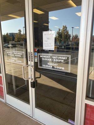Front door with sign apologizing for not being open. They still weren't open at 11am the next day.