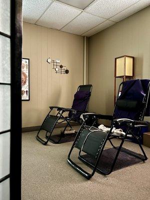 Treatment gravity chairs with chair heater controls