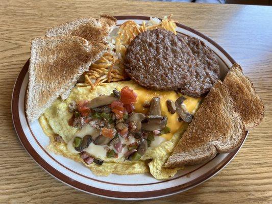 The Works omelette with a side of sausage patties