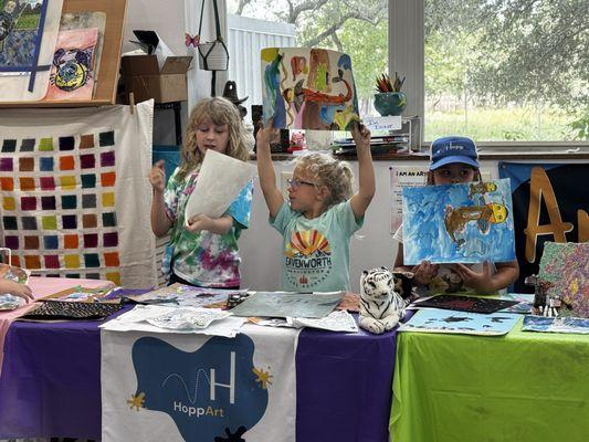 Students sharing their artwork.